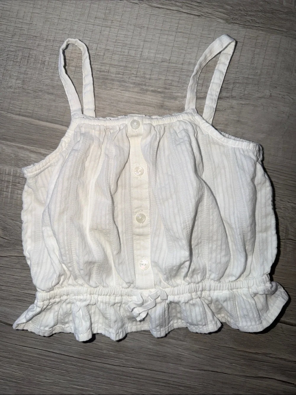 Sleeveless Buttoned Peplum Tank Top in white